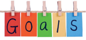 Colorful flags spelling out "Goals"